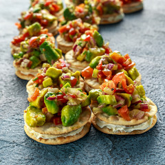 Salsa canape cracker appetizers with soft cheese