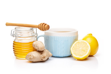 Honey and tea with spices and lemon.