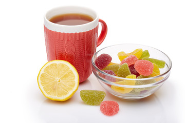 Fruit marmalade and tea with lemon.
