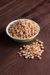 peas old in plate on wood