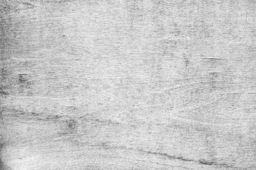 Close-up of a cracked and weathered plywood texture background in black&white.