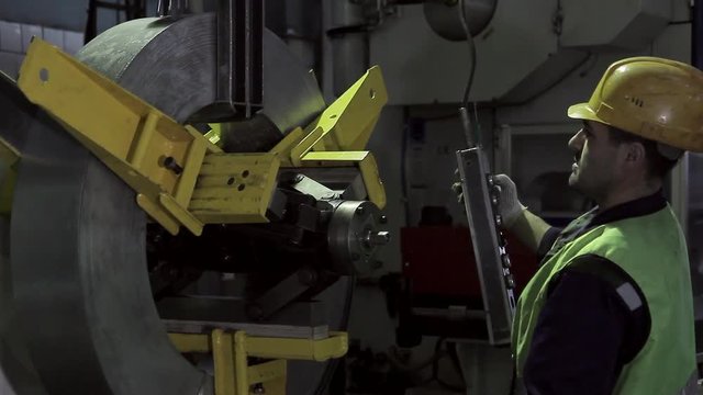 A man working on a heavy industry factory