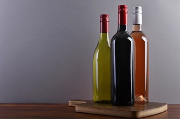 Fototapeta na wymiar Three bottles on a board