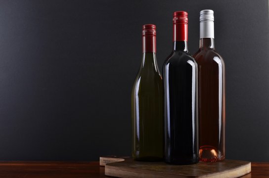 Three bottles on a board