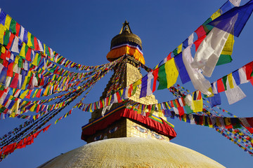 Top of the Boudhanath Stupa with prayer flags. Kathmandu valley, Nepal