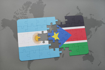 puzzle with the national flag of argentina and south sudan on a world map