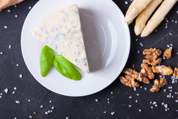 Blue cheese and camembert on plates