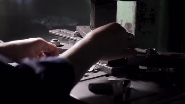 Close-up forming fasteners on the machine