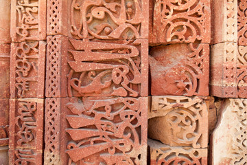 Ornate Stone Wall At The Qutub Minar In Delhi