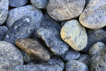 Pebbles on the beach close up.Stone background.Stones texture.Selective focus.