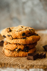 beautiful round chocolate cookies on burlap background