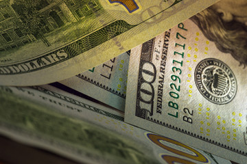 Fototapeta na wymiar Close up of 100 dollar money bills. Art shooting.