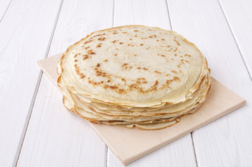 Pancakes on wooden background. Shrovetide