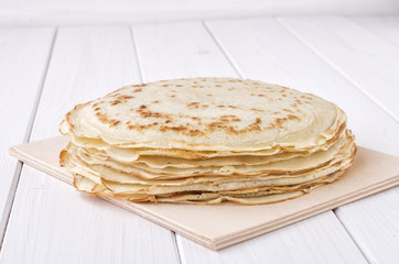 Pancakes on wooden background. Shrovetide