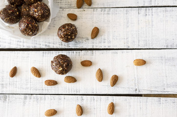 Vegan sweet delicious almond cocoa balls healthy and tasty food on wooden table