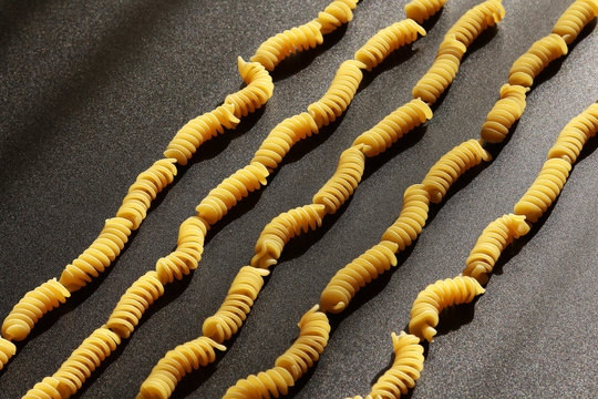 Italian pasta, still life on black background