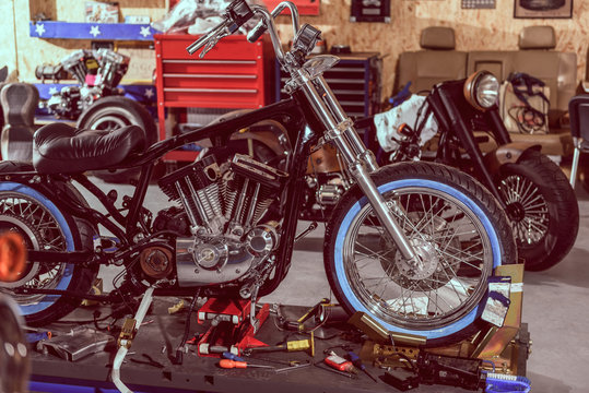 Motorcycle situating with instruments in garage