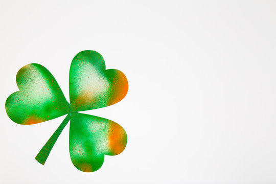 Spray pained on Irish lucky four-leaf clover isolated on white background