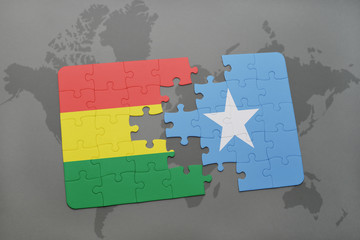 puzzle with the national flag of bolivia and somalia on a world map