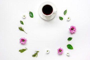 Petals and cup on table background top view mock up