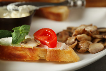 Tasty bruschetta on plate, closeup