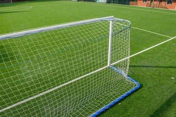 corner in the football field with artificial turf flag