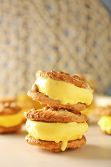 Delicious lemon ice cream cookie sandwiches on kitchen table