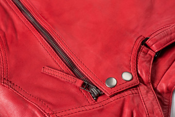 Red  leather jacket. Leather jacket macro details. Jacket zippers and pockets