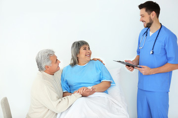 Senior man visiting wife in hospital