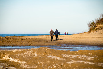 people enjoying frozen beach