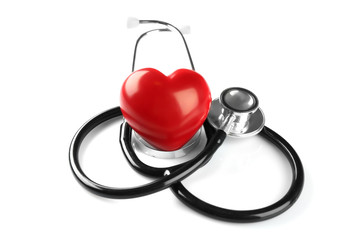 Stethoscope and red plastic heart isolated on white. Cardiology concept
