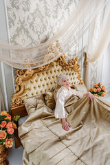 Elegant mature lady resting in bedroom