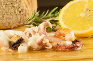 macro of fish salad with lemon and rosemary