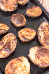 Baked potatoes in the oven with shell