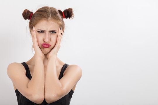 ridiculous fun girl grimaces on a white background