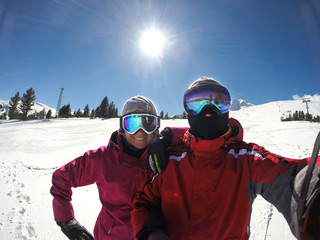 Fototapeta na wymiar Skiers couple at winter holiday