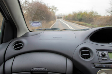 Car interior and road. Passenger view. 