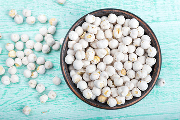 chickpeas in a bowl on a wooden background