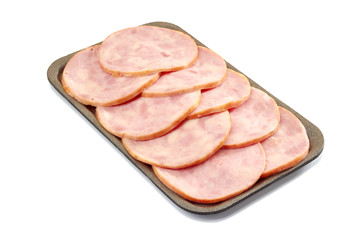 Sliced ham in retail tray on white