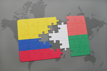 puzzle with the national flag of colombia and madagascar on a world map