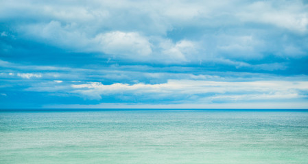 Sea, horizon and clouds in the sky.