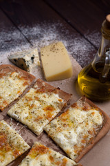 Pizza four cheese with oregano and olive oil. quattro fromaggi