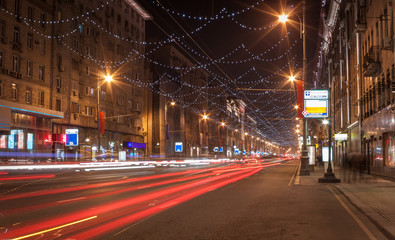 Naklejka na ściany i meble Moscow night cityscape with street traffic.