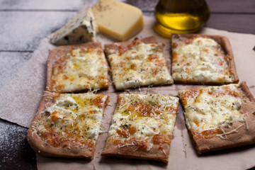 Pizza four cheese with oregano and olive oil. quattro fromaggi