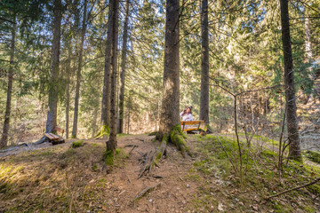 woman talking on mobile phone in forest