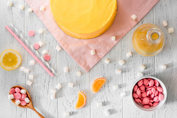 cooking lemon cake top view on wooden background