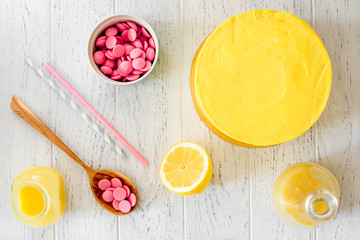 cooking lemon cake top view on wooden background