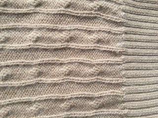 Knitted fabric woolen texture background, closeup surface image