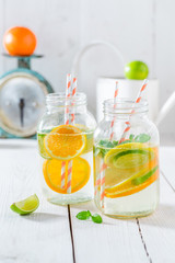 Healthy water with citrus fruits and mint leaves