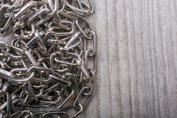 chain made of silver color metal on a grey background